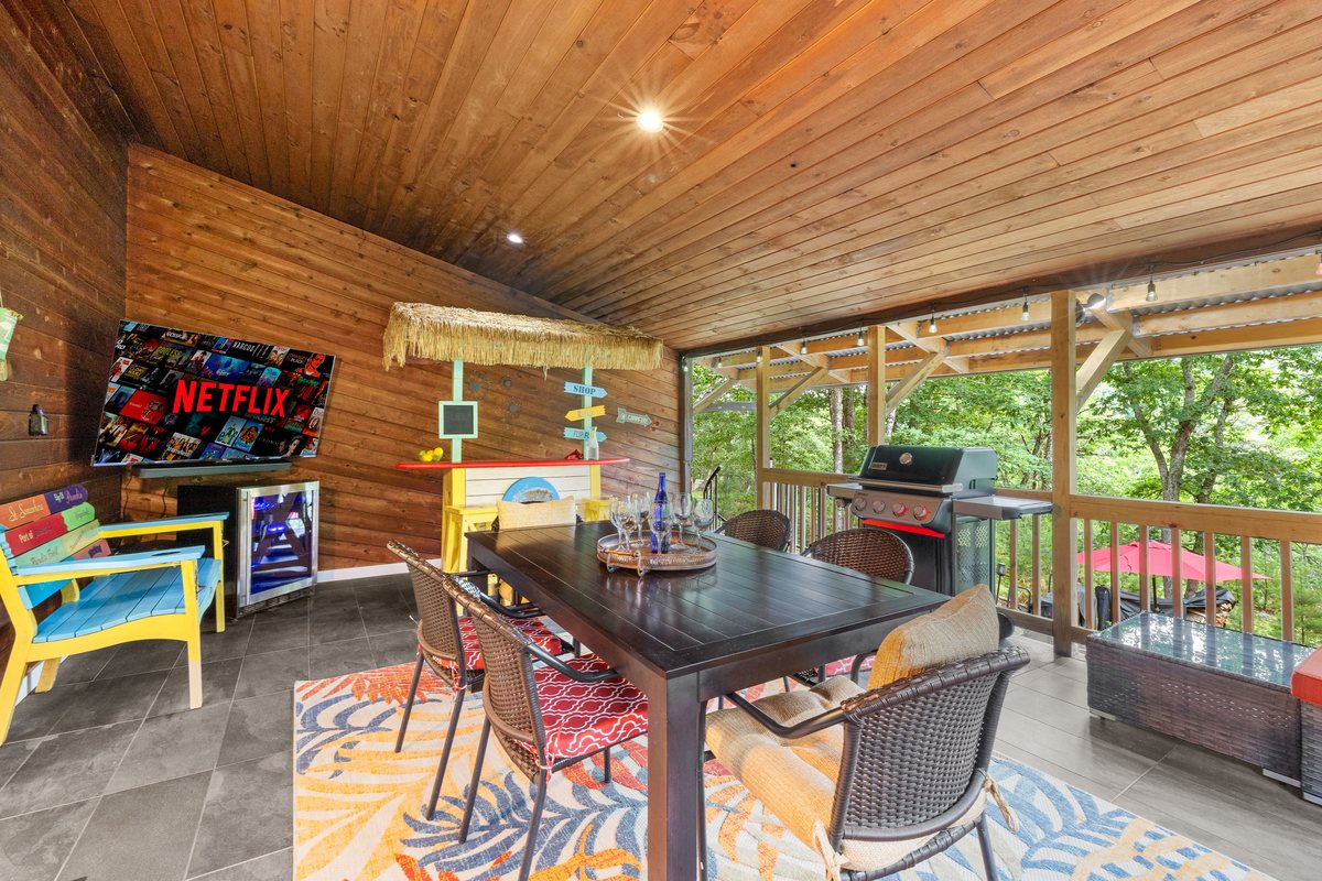 Back deck dining, seating, and grill area at Waterfall Wonder.