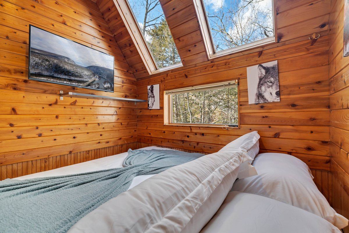 Cove open sleeping area at Waterfall Wonder with a king bed.