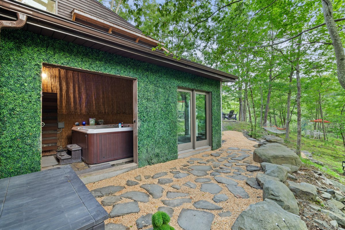 Outdoor hot tub area at the Poconos cabin.