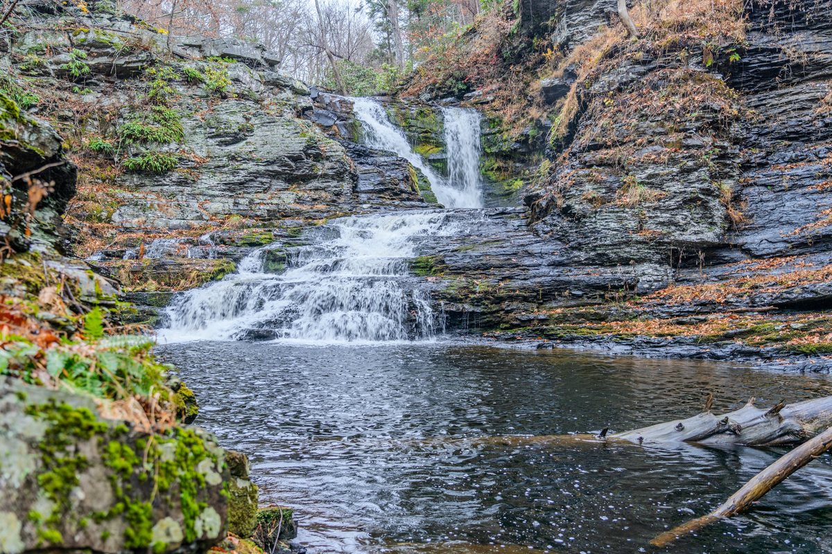 Wide view of the natural waterfall and creek near Waterfall Wonder.